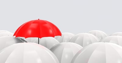 657-outstanding-one-red-umbrella-is-higher-than-the-others-on-gray-background-small