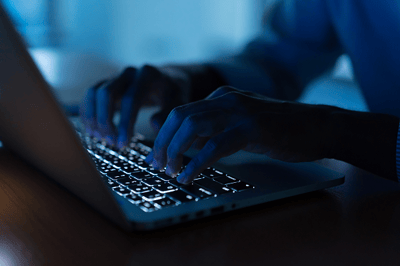 293-man-hand-typing-keyboard-input-code-for-register-system-600x400