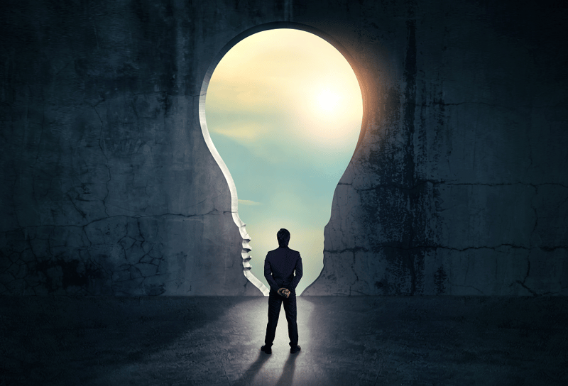 33-businessman-looking-out-abstract-opening-wall-1000x681